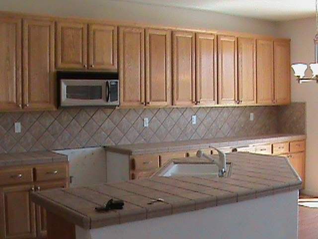 1035 Nicolaus Drive - Kitchen with Tile Countertops and Backsplash